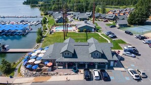 A lakeside hotel with a pool, parking, and a view of the mountains. - Dover Bay Luxe Home w/ Private Hot Tub - Sleeps 12 (Dover)