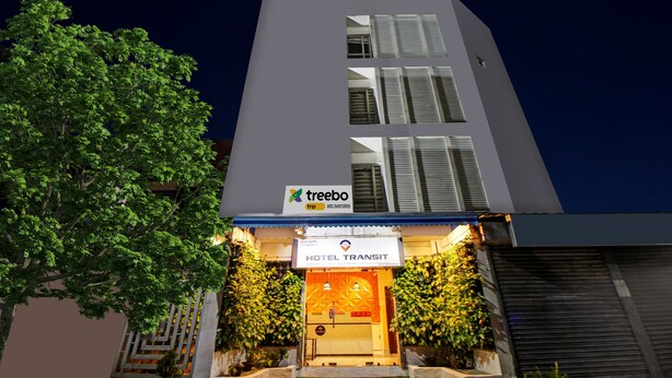 A hotel with a modern facade, a visible entrance, and a sign for 'treebo trip' indicating a partnership or service. - Itsy Hotels Transit Express Near Sealdah Station (Kolkata)