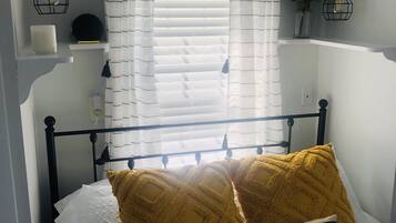 1 bedroom, desk, iron/ironing board, travel crib