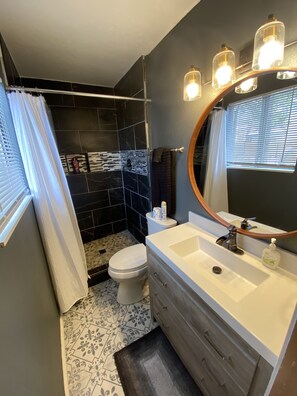Bathtub, hair dryer, towels, soap