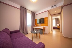 Deluxe Suite | Living area | 43-inch LED TV with satellite channels