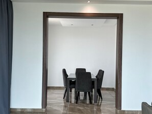 Enjoy meals in this dining area with a rectangular table and four chairs.