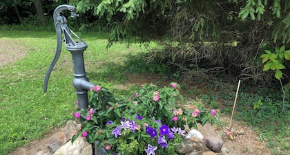 Charming, recently updated country ranch home on quiet, scenic, acre lot.