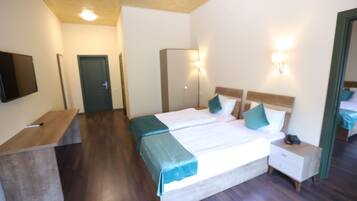 Deluxe Quadruple Room | Frette Italian sheets, premium bedding, Tempur-Pedic beds, minibar