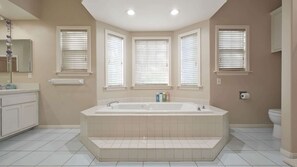 Bathtub, hair dryer, towels, soap