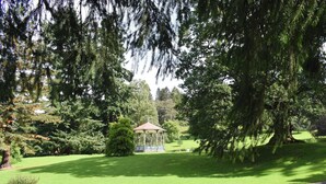 A park with a gazebo, a bench, and a path. - A lovely hideaway in the heart of historic Crieff. (Crieff)