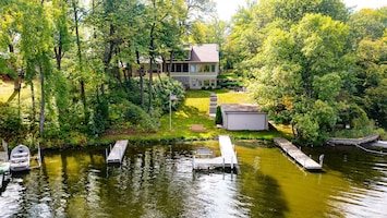 Level lakeshore with 3 docks for tieing up water craft.  Access to boat house.