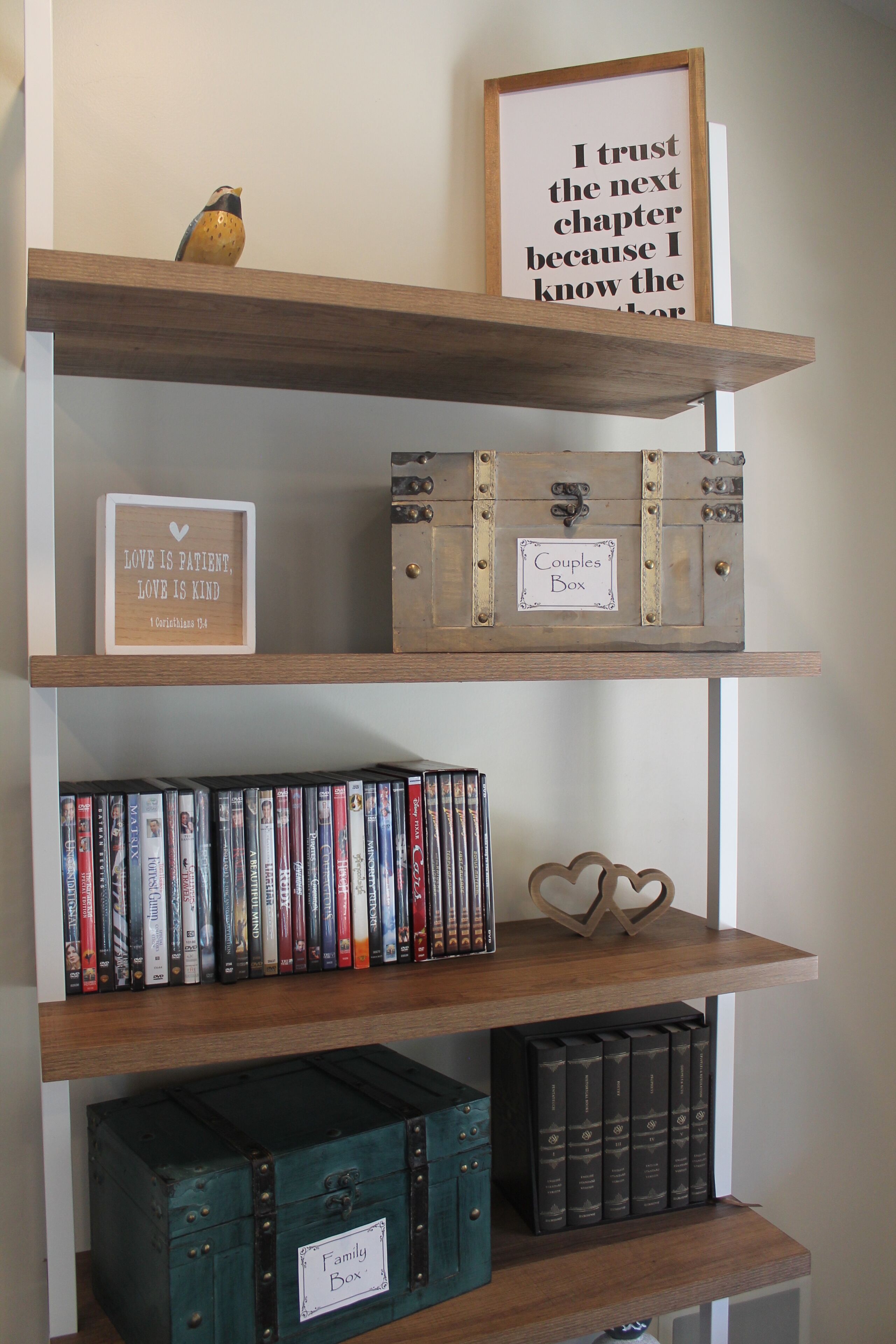 A bookshelf with various books and decorative items.