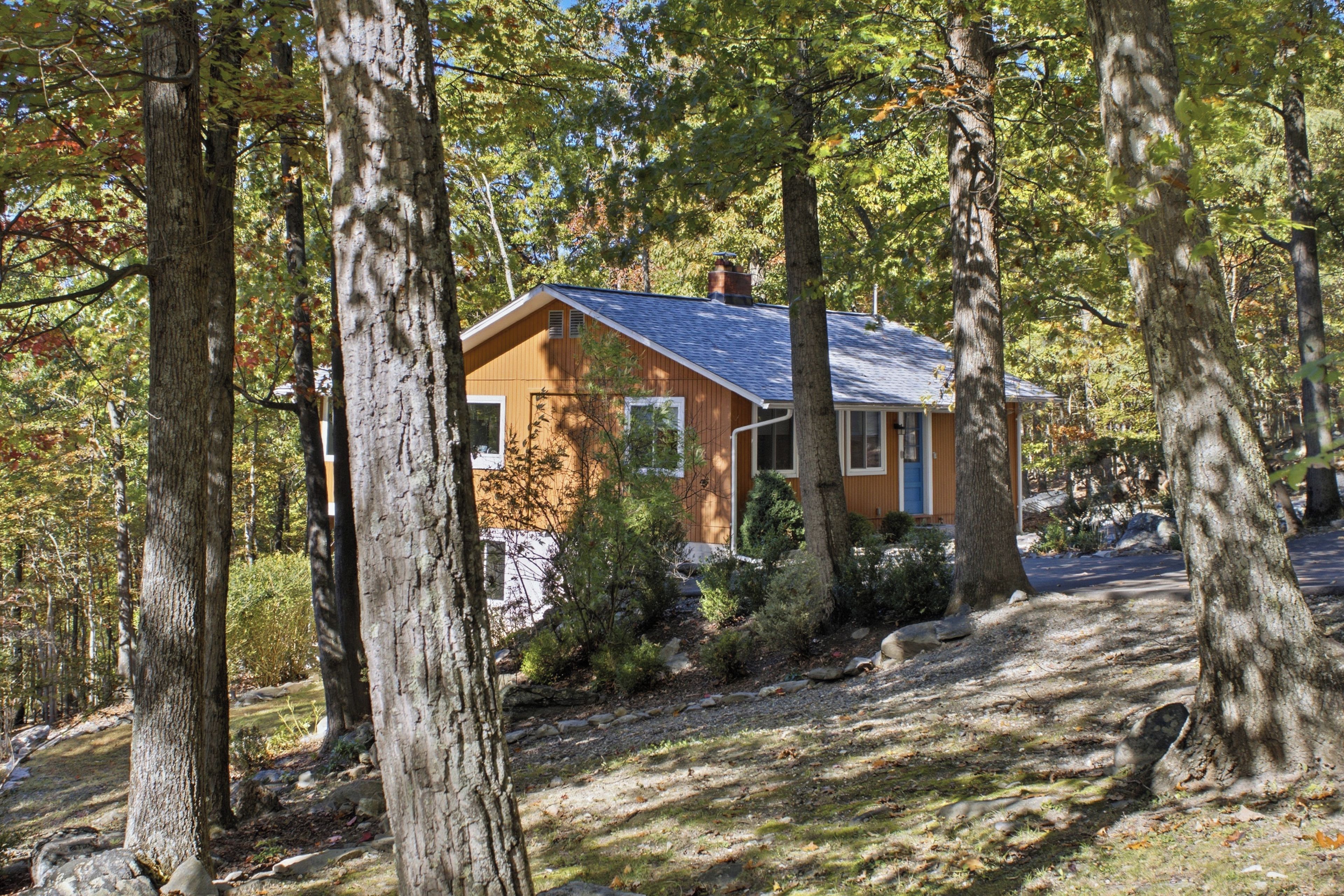 Tucked in a beautifully wooded lot