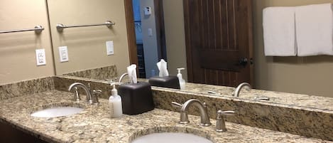 Combined shower/tub, hair dryer, towels, soap