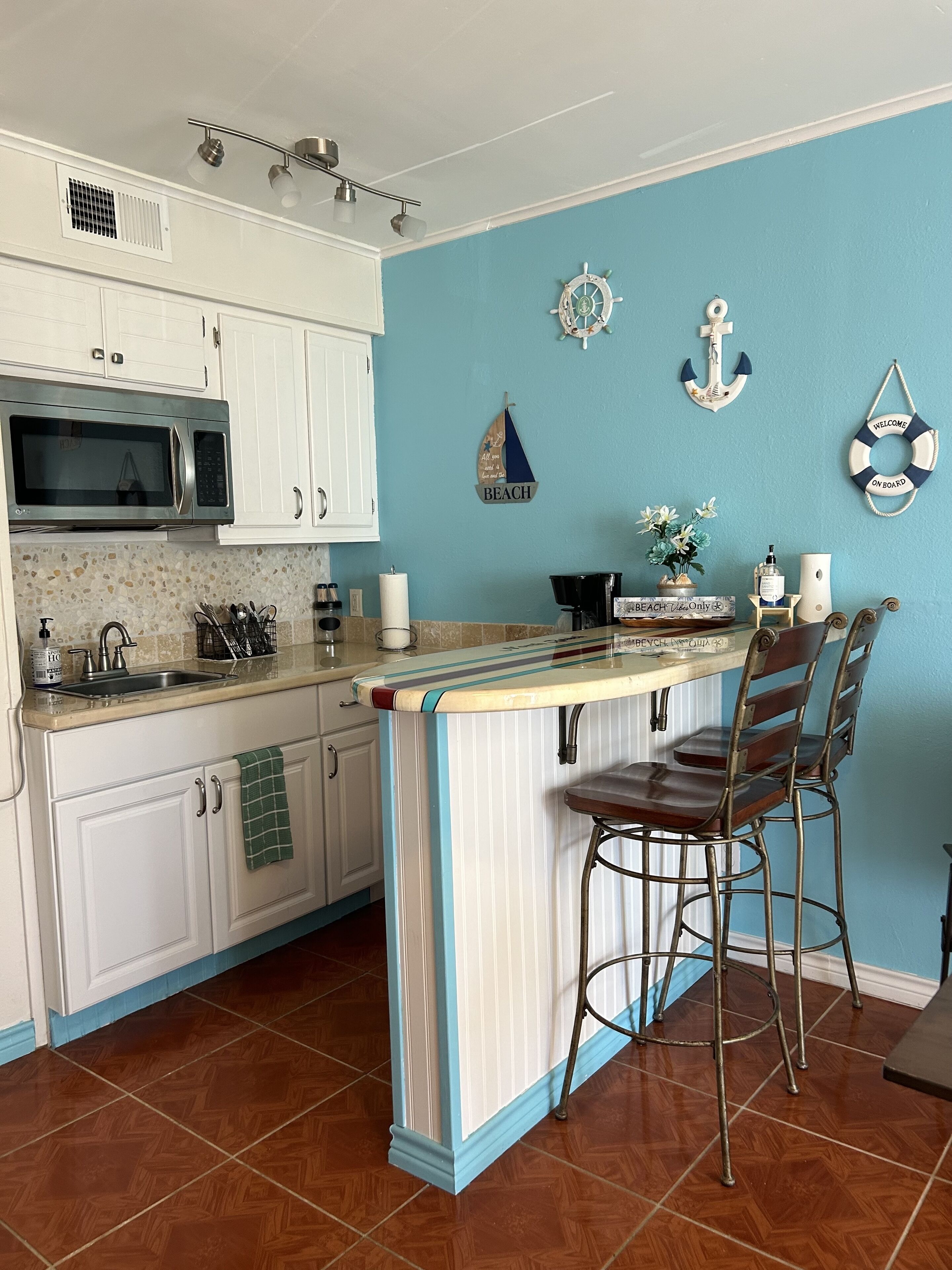 Fridge, microwave, stovetop, coffee/tea maker