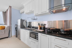 Apartment, 2 Bedrooms | Private kitchen | Full-size fridge, microwave, oven, stovetop - CYAN by Kozystay (Jakarta)