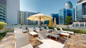 Outdoor pool - WelHome - Cozy 1BR With Private Balcony Steps From the Canal (Dubai)