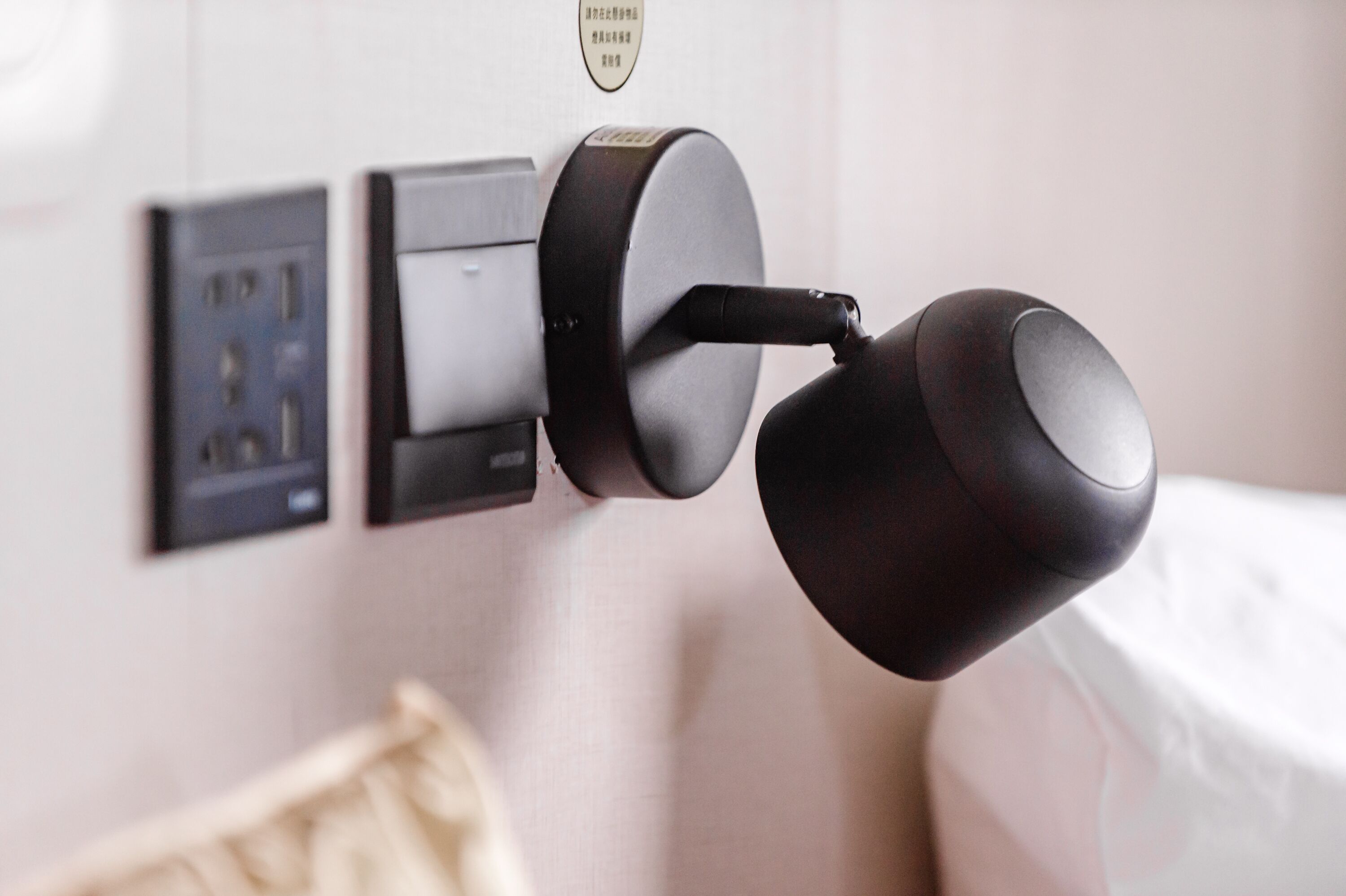 A modern door lock system with a keyhole and a card reader.