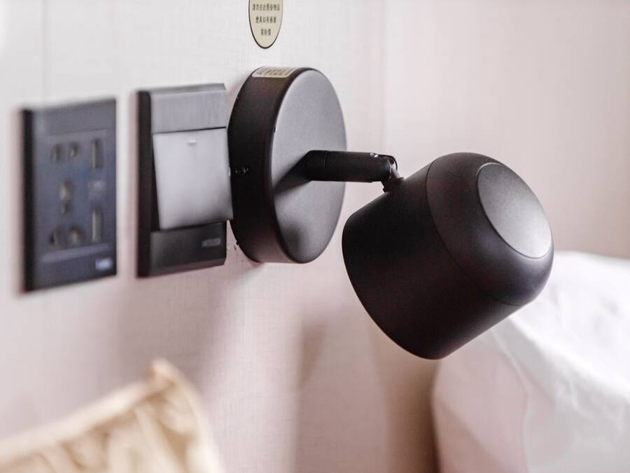 A modern door lock system with a keyhole and a card reader.