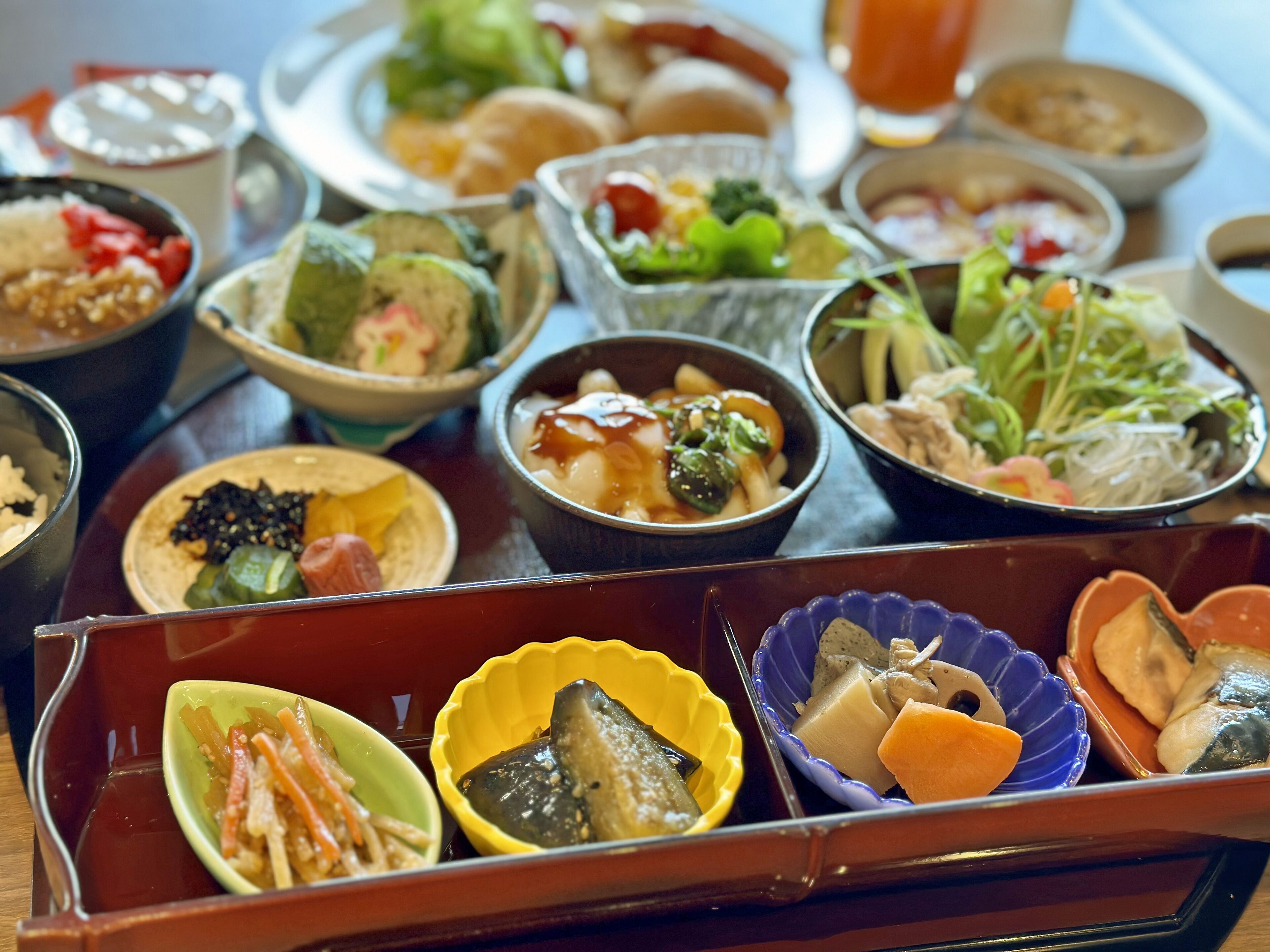 A variety of dishes in traditional bowls, suggesting a meal setting.
