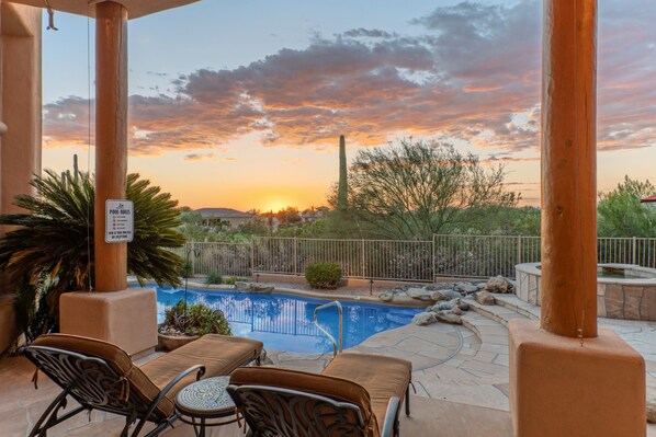 An outdoor pool area with lounge chairs and a sign indicating pool rules. - Golf Colony w/Golf, Mt & City Views: Salt H2O Pvt POOL, Spa, Kiva Fireplace, TVs All BRs (Mesa)