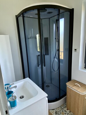 Shower, hair dryer, towels, soap