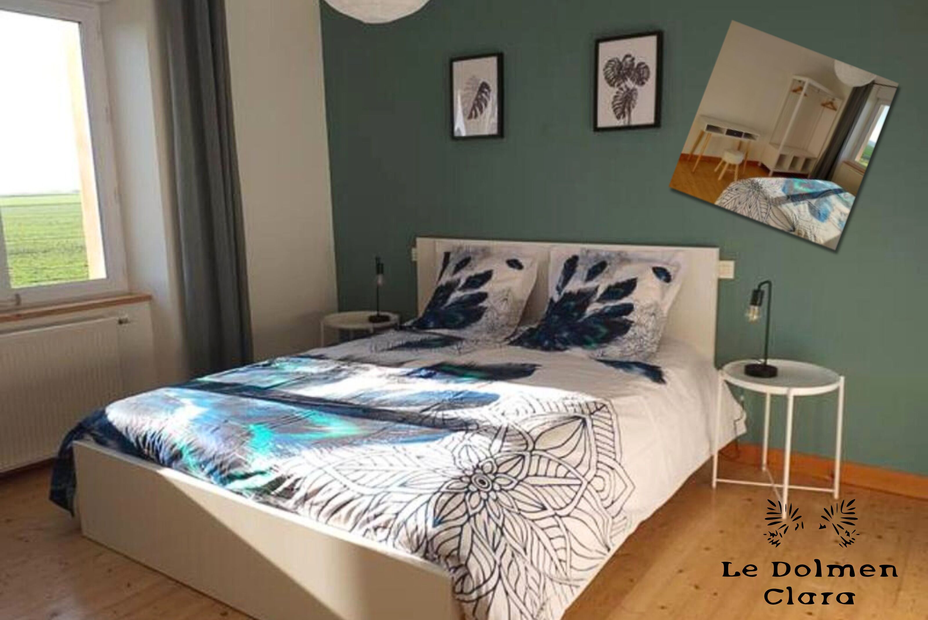 A bedroom with a bed, two bedside tables, a window, and artwork on the wall.