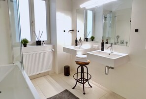 Combined shower/tub, hair dryer, towels, soap