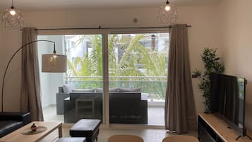 Comfort Apartment | Living area | 55-inch LED TV with digital channels, TV, Netflix
