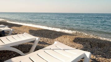 On the beach, white sand, beach shuttle, sun loungers