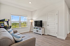 TV, fireplace - Direct water views in Windmark Beach home. (Port St. Joe)
