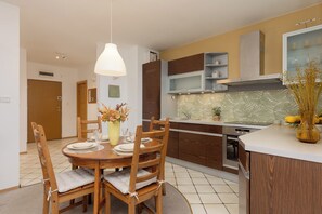 Apartment, 1 Bedroom, Balcony | Private kitchen | Microwave, coffee/tea maker, cookware/dishes/utensils, freezer - Pejzażowa Apartment Metro Wilanowska (Warsaw)