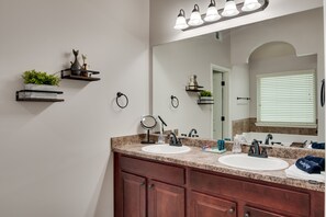 Combined shower/tub, hair dryer, towels, soap