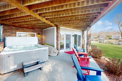 Waterfront home with private beach on the lake, hot tub, & dock