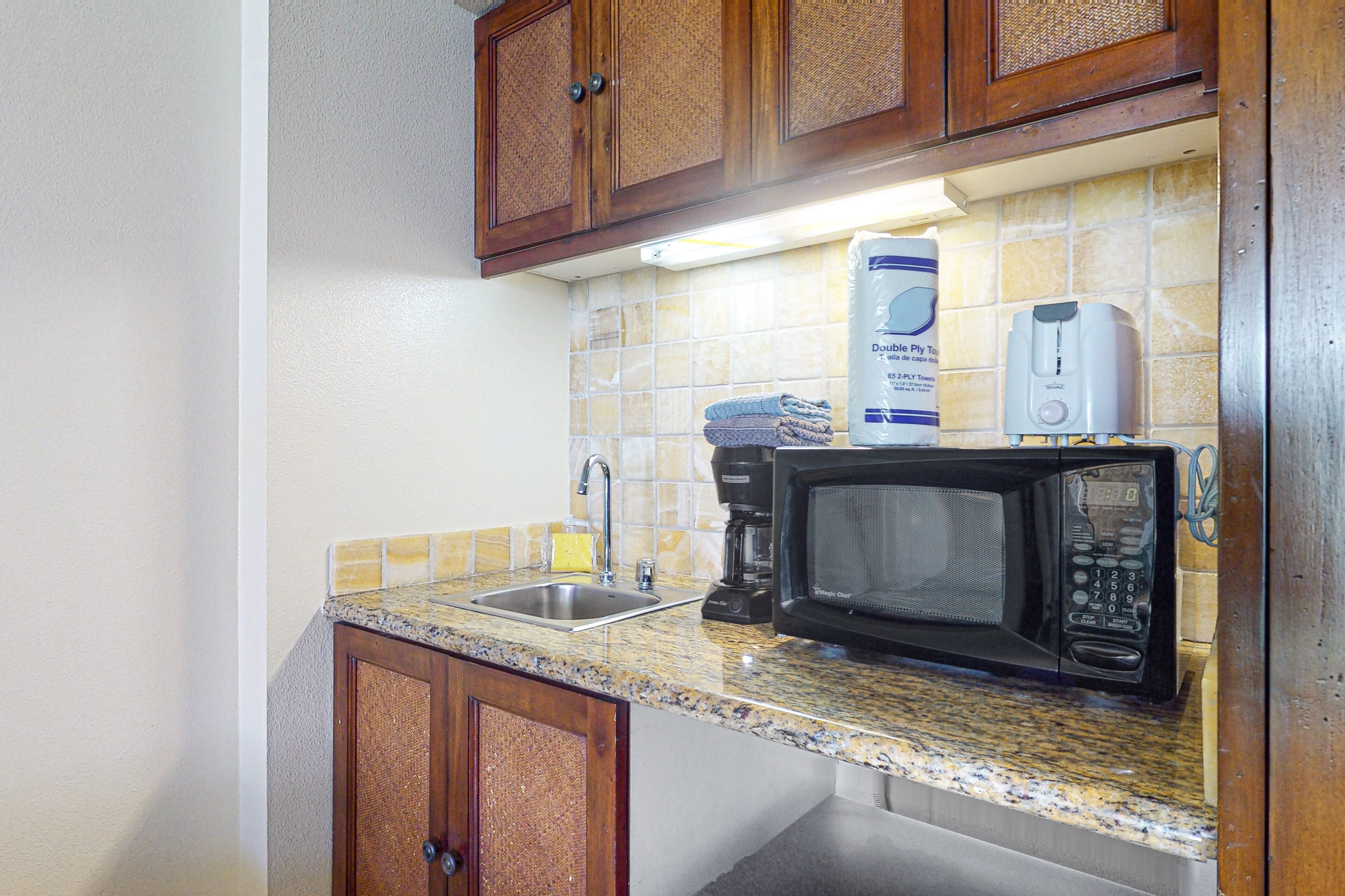 Fridge, microwave, coffee/tea maker, cookware/dishes/utensils