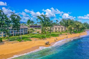 Enjoy stunning ocean views from your balcony overlooking the sandy beach and clear waters.