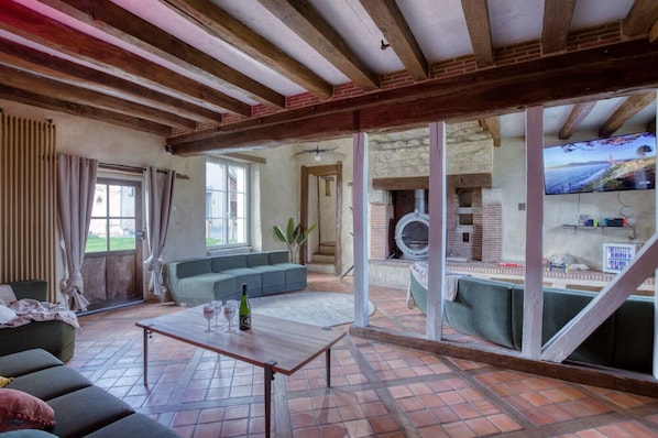 TV, fireplace, video game console, table football