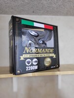A box of Normande 2200W golf balls on a shelf.
