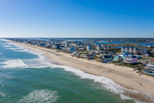Overlooking the ocean, this beachfront property offers stunning views of the coastline.