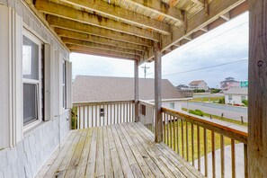 Enjoy the view from this balcony overlooking the neighborhood.