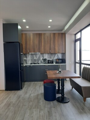 Fridge, microwave, stovetop, coffee/tea maker