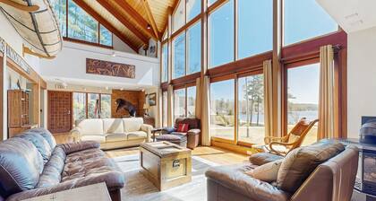 Lakefront home with gym, game room, home theatre, & private beach with boathouse