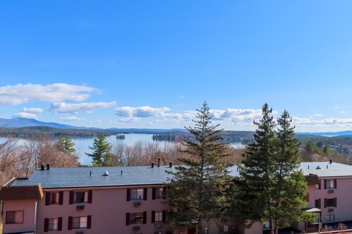 Water view condo with a pool, tennis court, fireplace, balcony & golf nearby