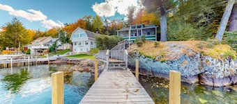 Charming dog-friendly lakefront cottage with private dock & community beach