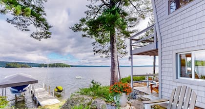Renovated home with a water view, washer/dryer, AC, deck & wood stove