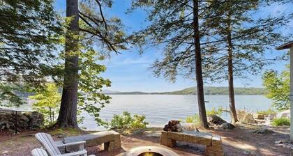 Captivating lakefront home with private dock, row boat, firepit, and lake views