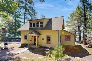 Exterior - Captivating lakefront home with private dock, row boat, firepit, and lake views (Meredith)
