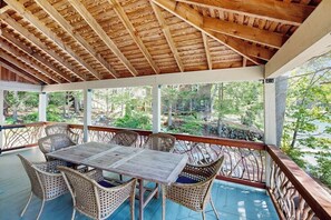 Outdoor dining - Captivating lakefront home with private dock, row boat, firepit, and lake views (Meredith)