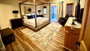 A four-poster bed with a modern design, a wooden ceiling, and a large window with curtains. - Cozy Tahoe Donner Retreat – Hot Tub, Fireplace & Near Ski Resorts! (Truckee)