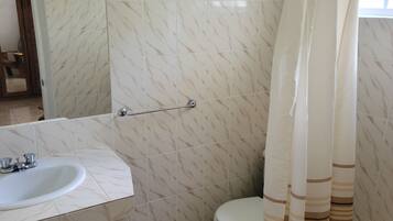 Shower, hair dryer, towels, toilet paper