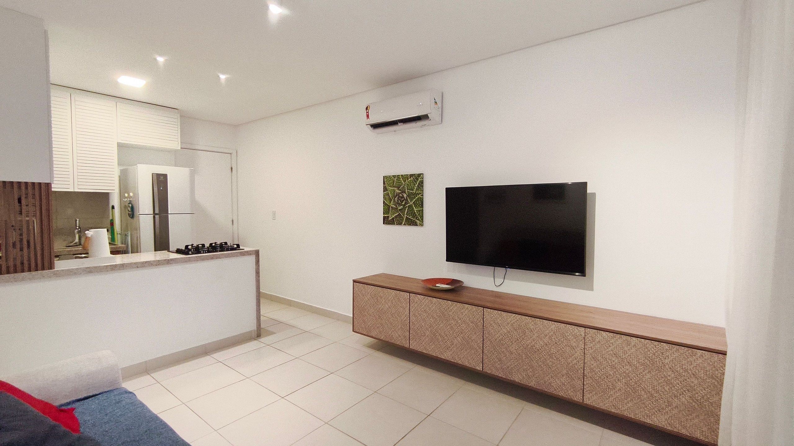A modern kitchen with a built-in stove, a refrigerator, and a microwave.