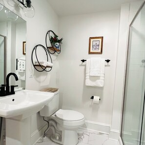 Shower, hair dryer, towels, soap