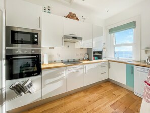 Dishwasher, high chair, cookware/dishes/utensils