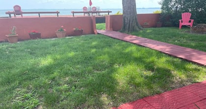 Restored historic log cabin and deck on Lake Erie